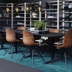 Con chairs in leather and Myk table Fora Form