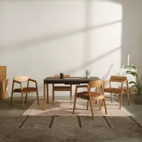 Knekk chair with armrest and cushions and Knekk Wood table from Fora Form