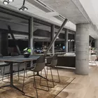 Con bar stools with veneer backrest and Kvart table at Fora Form