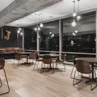 Con chairs with veneer backrest and Myk table at Fora Form