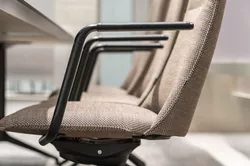 Fjell chairs with leather detail on armrest Fora Form