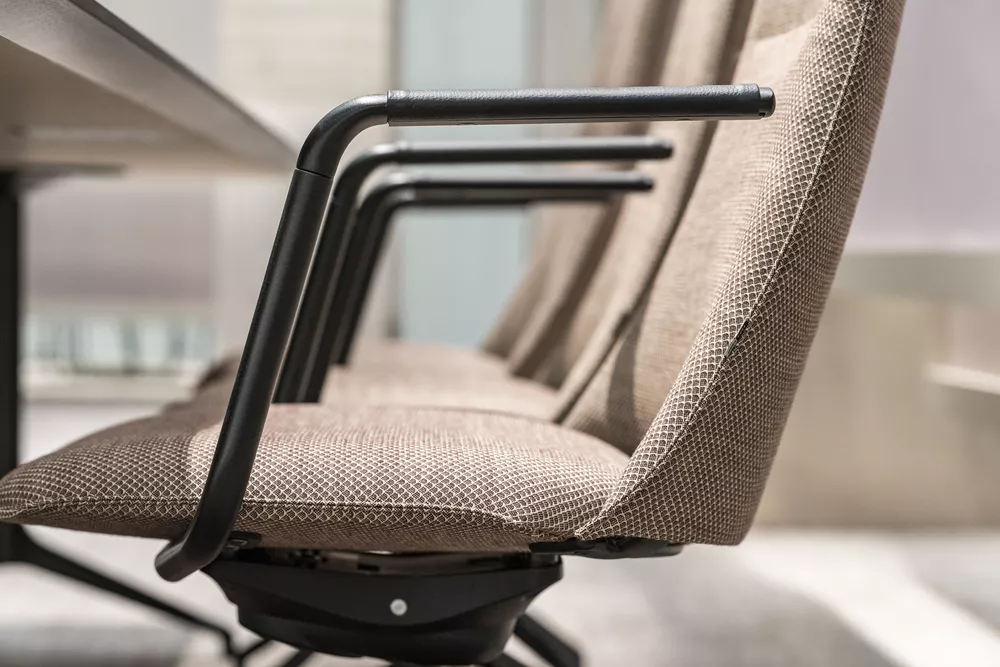 Fjell chairs with leather detail on armrest Fora Form